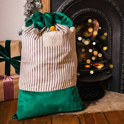 Personalised Christmas sacks with pom pom details and embroidered personalised tag.