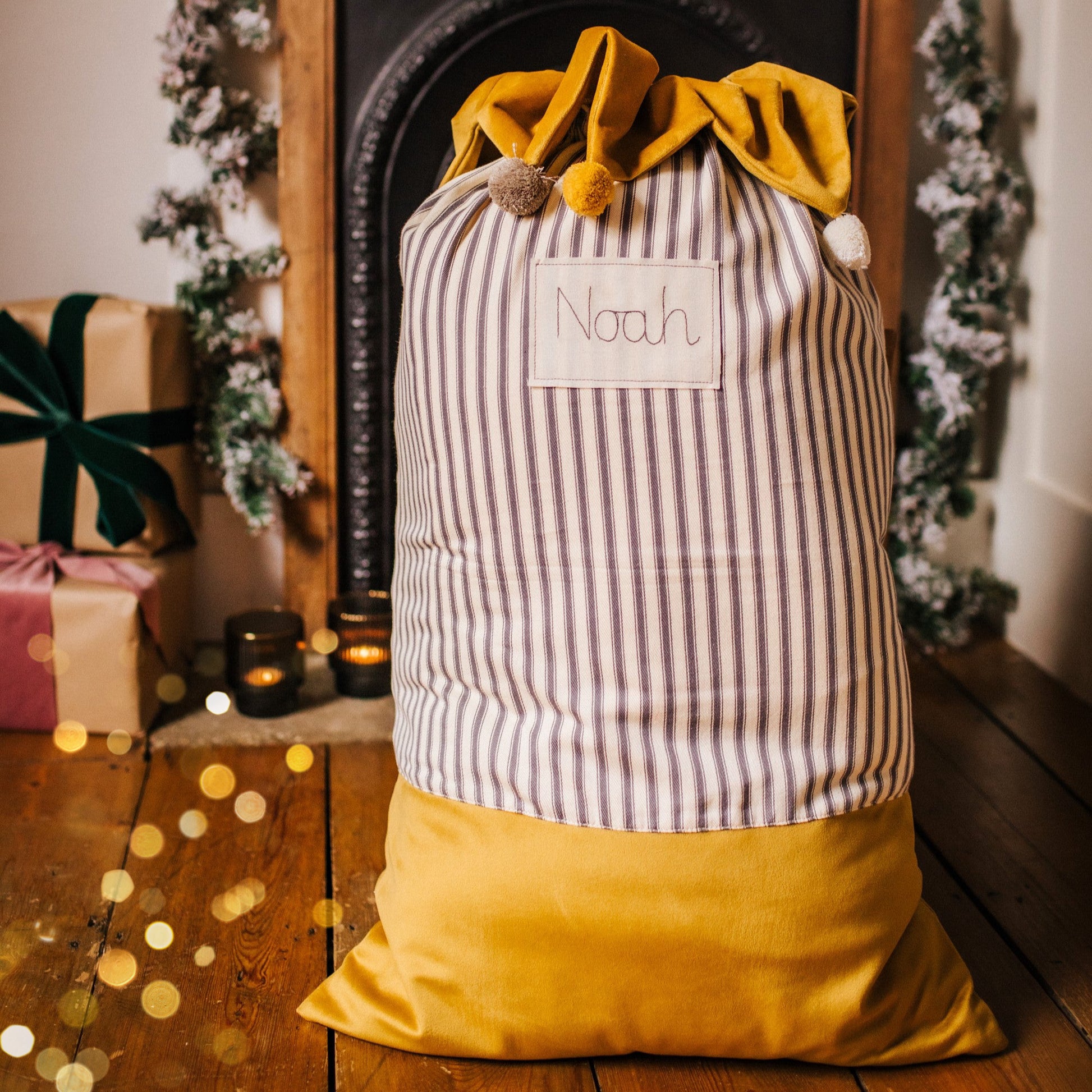 Personalised Christmas sacks with pom pom details and embroidered personalised tag.