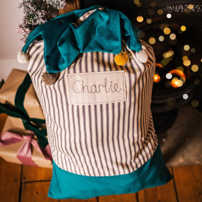 Personalised Christmas sacks with pom pom details and embroidered personalised tag.