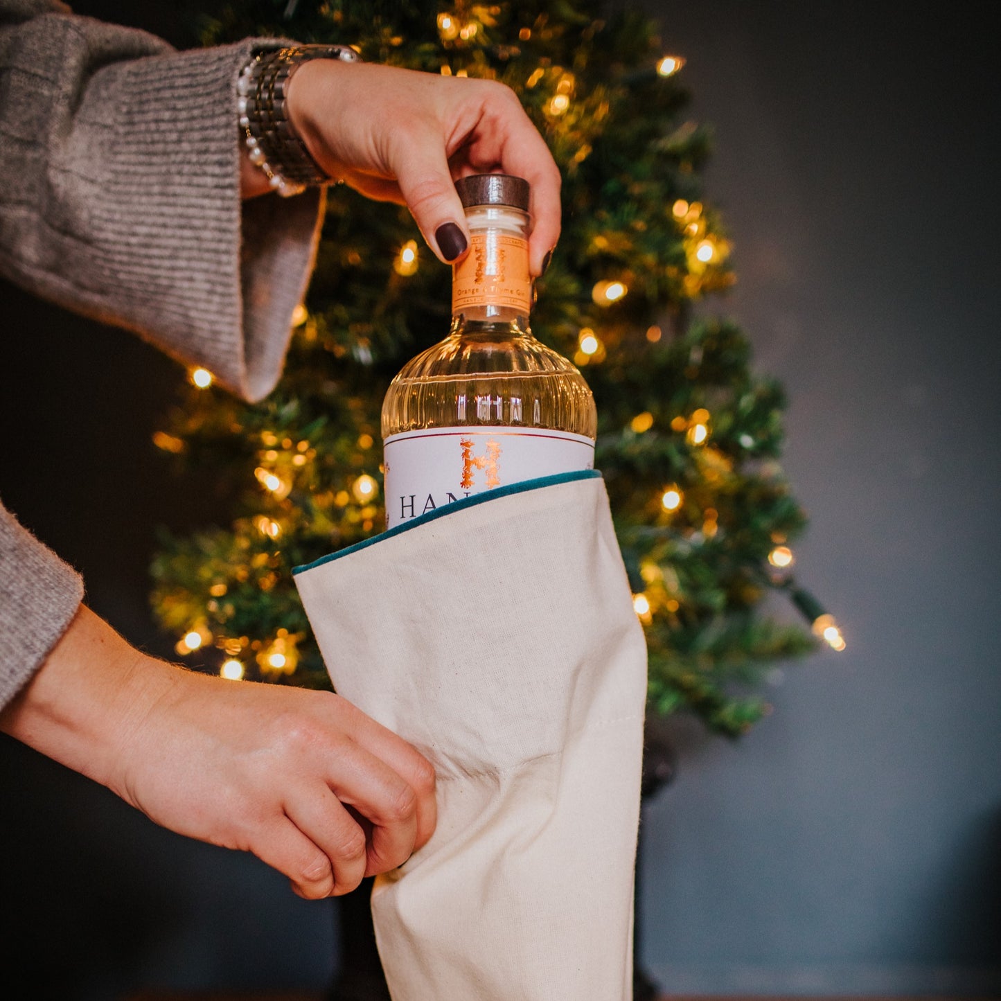 A reusable cotton and velvet gift bag with gift tag